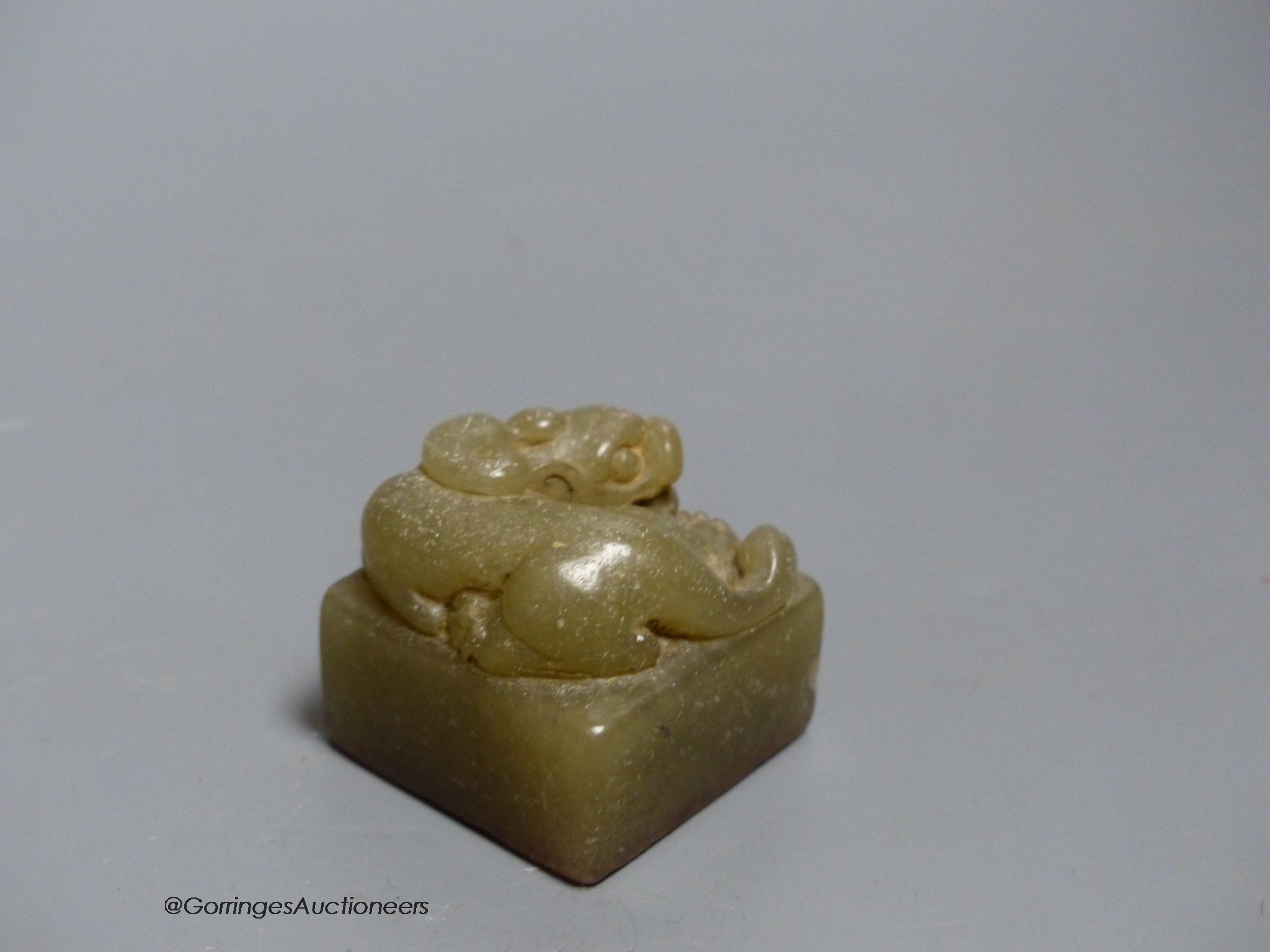 A Chinese carved soapstone 'lion-dog' seal, height 3.5cm